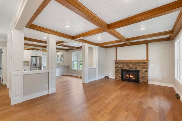 Empty room, Fireplace, Interior, Kitchen, Recessed Lighting, Stainless Steel Appliances, Wooden Beams, Wood Texture Flooring