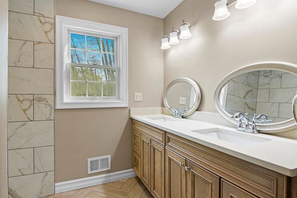 Bathroom, Dual Sink Vanities, Interior, Marble Walls, Wood Texture Flooring