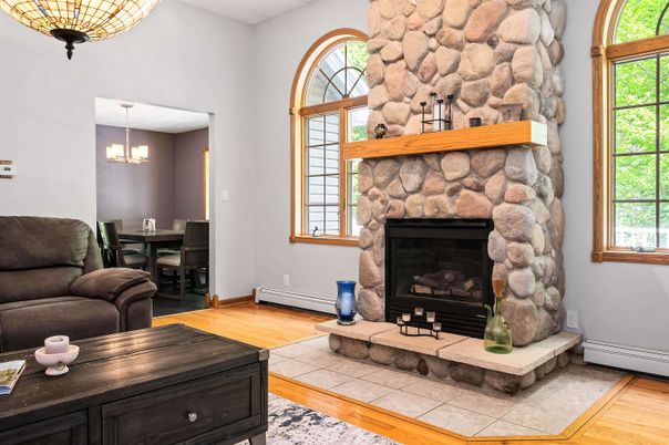 Chandelier, Dining room, Fireplace, Interior, Pendant Lights, Stone Walls, Wood Texture Flooring