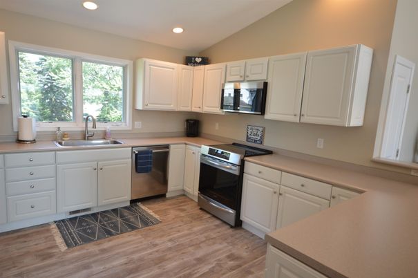 Interior, Kitchen, Recessed Lighting, Stainless Steel Appliances, Wood Texture Flooring
