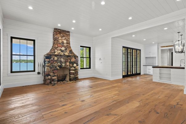 Empty room, Fireplace, Interior, Kitchen, Pendant Lights, Recessed Lighting, Stone Walls, Wood Texture Flooring