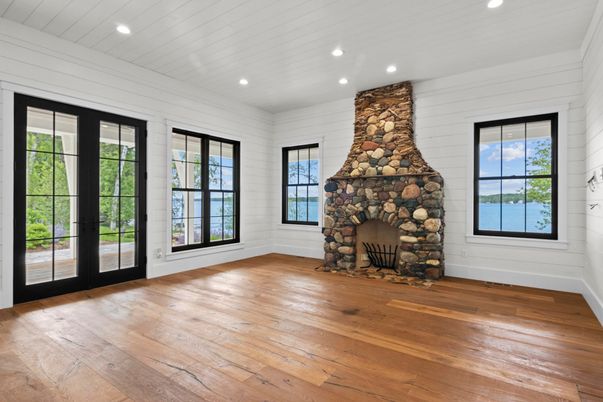 Empty room, Fireplace, Interior, Recessed Lighting, Stone Walls, Wood Texture Flooring