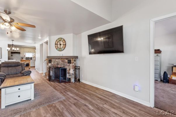 Chandelier, Fireplace, Interior, Kitchen, Recessed Lighting, Wood Texture Flooring