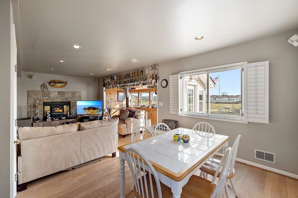 Dining room, Fireplace, Interior, Living room, Recessed Lighting, Wood Texture Flooring