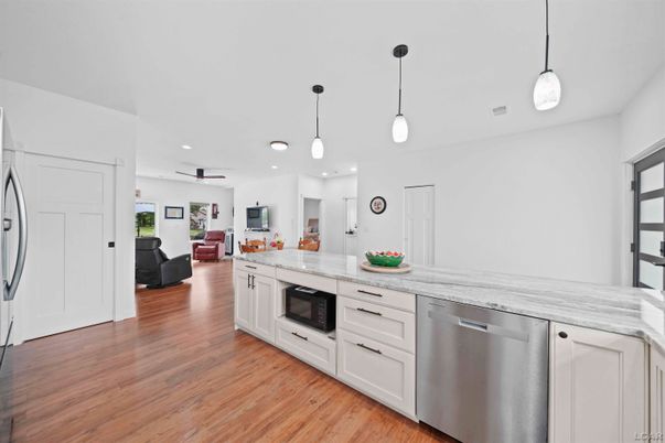 Interior, Kitchen, Pendant Lights, Recessed Lighting, Stainless Steel Appliances, Wood Texture Flooring