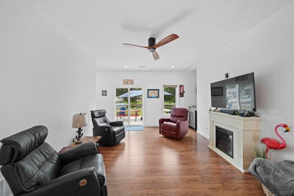 Fireplace, Interior, Living room, Recessed Lighting, Wood Texture Flooring
