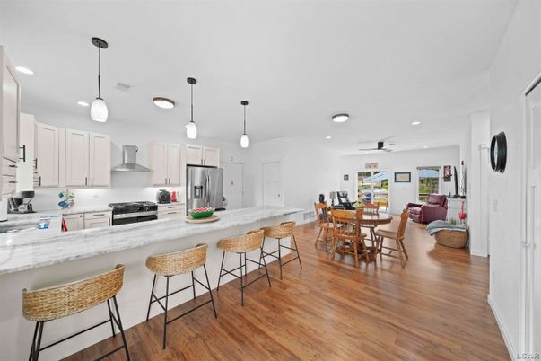 Dining room, Interior, Kitchen, Pendant Lights, Recessed Lighting, Stainless Steel Appliances, Wood Texture Flooring