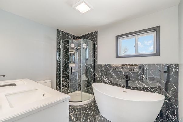 Bathroom, Free Standing Baths, Glass Shower, Interior, Marble Walls, Recessed Lighting