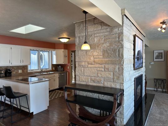 Fireplace, Interior, Kitchen, Pendant Lights, Stone Walls, Wood Texture Flooring