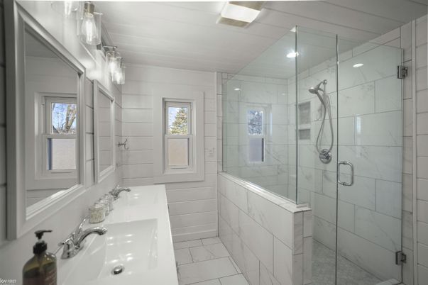 Bathroom, Dual Sink Vanities, Glass Shower, Interior, Marble, Marble Walls, Recessed Lighting
