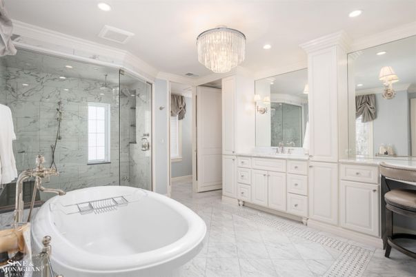 Bathroom, Chandelier, Dual Sink Vanities, Free Standing Baths, Glass Shower, Interior, Marble, Marble Walls, Recessed Lighting