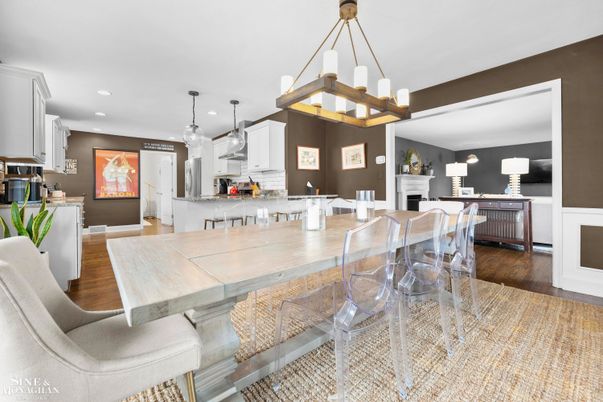 Dining room, Fireplace, Interior, Kitchen, Living room, Pendant Lights, Recessed Lighting, Stainless Steel Appliances, Wood Texture Flooring