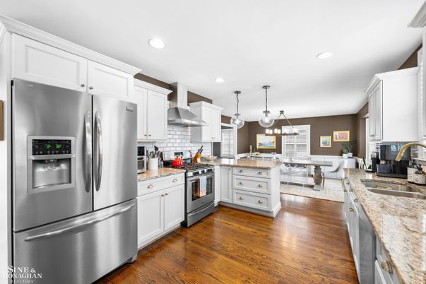 Dining room, Interior, Kitchen, Living room, Pendant Lights, Recessed Lighting, Stainless Steel Appliances, Wood Texture Flooring