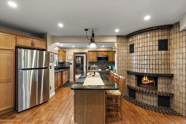 Fireplace, Interior, Kitchen, Pendant Lights, Recessed Lighting, Stainless Steel Appliances, Wood Texture Flooring