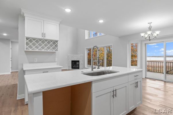 Chandelier, Fireplace, Interior, Kitchen, Recessed Lighting, Wood Texture Flooring