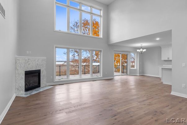 Chandelier, Empty room, Fireplace, Interior, Recessed Lighting, Wood Texture Flooring