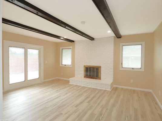 Empty room, Fireplace, Interior, Recessed Lighting, Stone Walls, Wooden Beams, Wood Texture Flooring