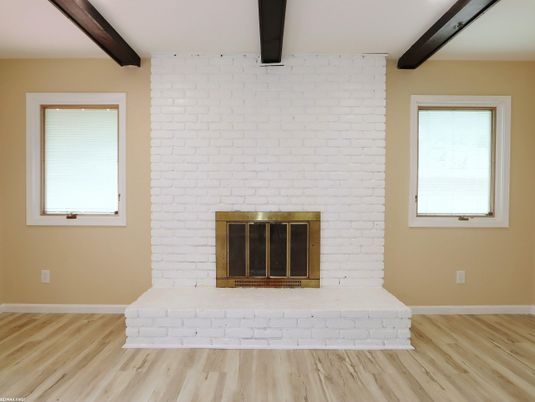 Empty room, Fireplace, Interior, Stone Walls, Wooden Beams, Wood Texture Flooring