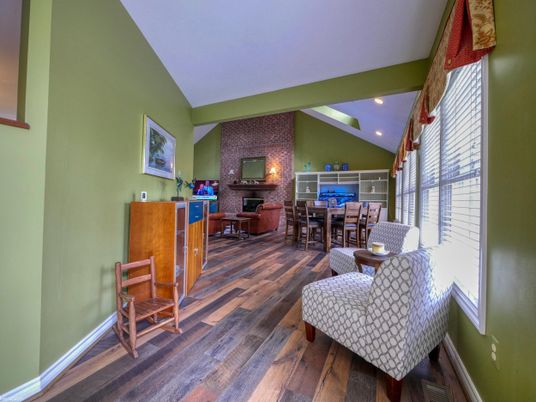 Dining room, Fireplace, Interior, Living room, Recessed Lighting, Stone Walls, Wood Texture Flooring