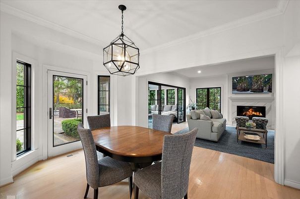 Chandelier, Dining room, Fireplace, Interior, Living room, Pendant Lights, Recessed Lighting, Wood Texture Flooring