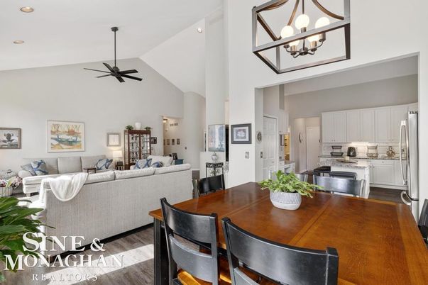Chandelier, Dining room, Interior, Kitchen, Living room, Pendant Lights, Recessed Lighting, Stainless Steel Appliances, Wood Texture Flooring