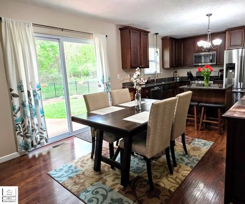 Chandelier, Dining room, Interior, Kitchen, Pendant Lights, Stainless Steel Appliances, Wood Texture Flooring