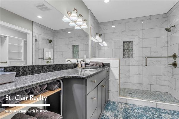 Bathroom, Dual Sink Vanities, Glass Shower, Interior, Marble Walls, Recessed Lighting
