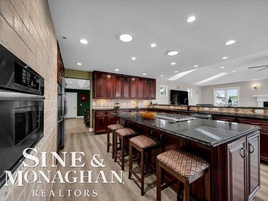 Fireplace, Interior, Kitchen, Recessed Lighting, Stainless Steel Appliances, Wood Texture Flooring