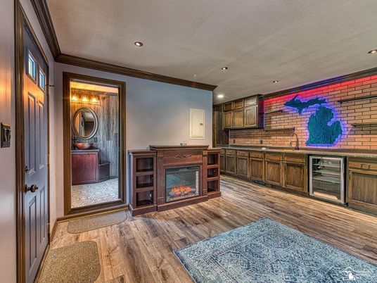 Fireplace, Interior, Kitchen, Recessed Lighting, Stone Walls, Wood Texture Flooring