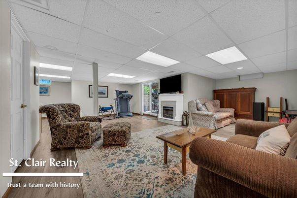 Fireplace, Fitness Equipment, Interior, Living room, Recessed Lighting, Wood Texture Flooring
