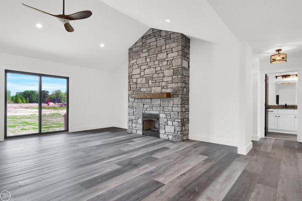 Empty room, Fireplace, Interior, Recessed Lighting, Stone Walls, Wood Texture Flooring