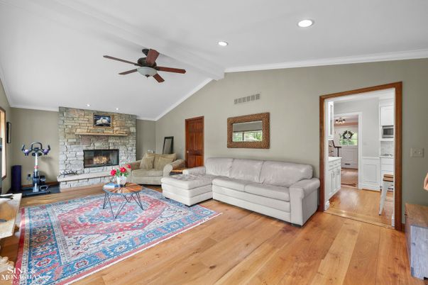 Fireplace, Interior, Living room, Recessed Lighting, Stone Walls, Wood Texture Flooring