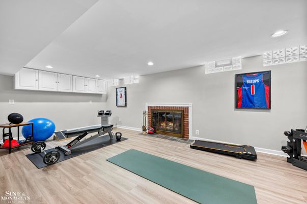 Fireplace, Fitness Equipment, Interior, Recessed Lighting, Wood Texture Flooring