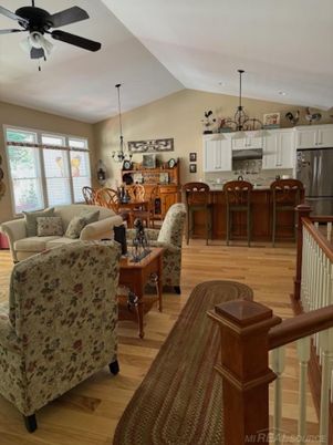 Chandelier, Dining room, Interior, Kitchen, Living room, Pendant Lights, Stainless Steel Appliances, Wood Texture Flooring