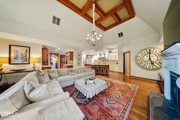 Chandelier, Fireplace, Interior, Kitchen, Living room, Recessed Lighting, Wood Texture Flooring