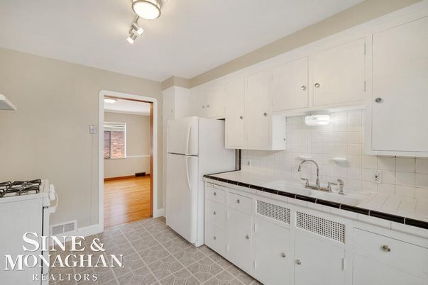 Interior, Kitchen, Tile Countertops, Wood Texture Flooring