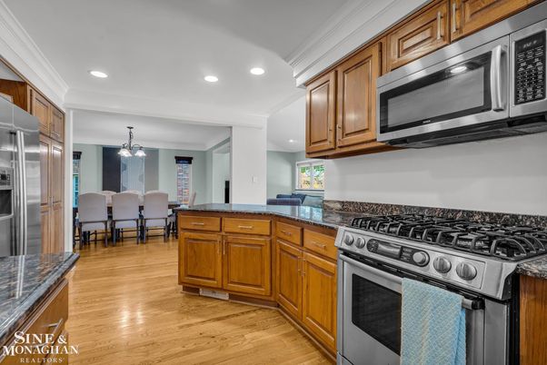 Chandelier, Dining room, Interior, Kitchen, Pendant Lights, Recessed Lighting, Stainless Steel Appliances, Wood Texture Flooring