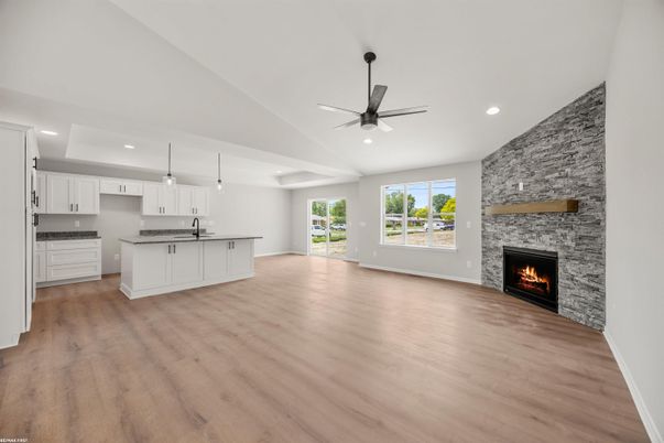 Empty room, Fireplace, Interior, Kitchen, Pendant Lights, Recessed Lighting, Stone Walls, Wood Texture Flooring