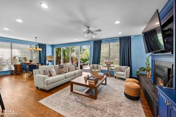 Chandelier, Dining room, Fireplace, Interior, Living room, Pendant Lights, Recessed Lighting, Wood Texture Flooring