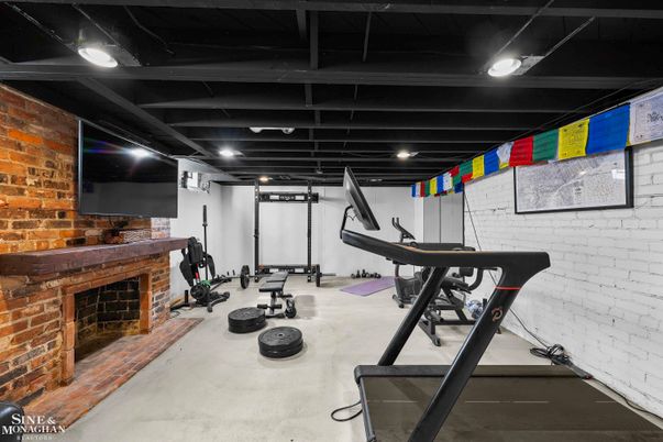 Fireplace, Fitness Equipment, Interior, Recessed Lighting, Stone Walls