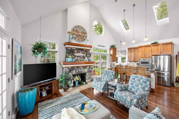 Fireplace, Interior, Kitchen, Living room, Pendant Lights, Stainless Steel Appliances, Wood Texture Flooring