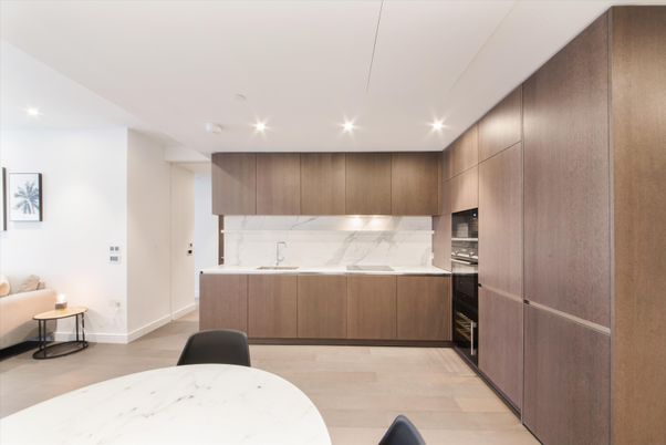 Interior, Kitchen, Marble Walls, Recessed Lighting, Stainless Steel Appliances, Wood Texture Flooring