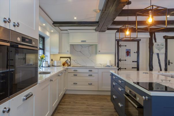 Interior, Kitchen, Marble Walls, Pendant Lights, Recessed Lighting, Stainless Steel Appliances, Wood Texture Flooring