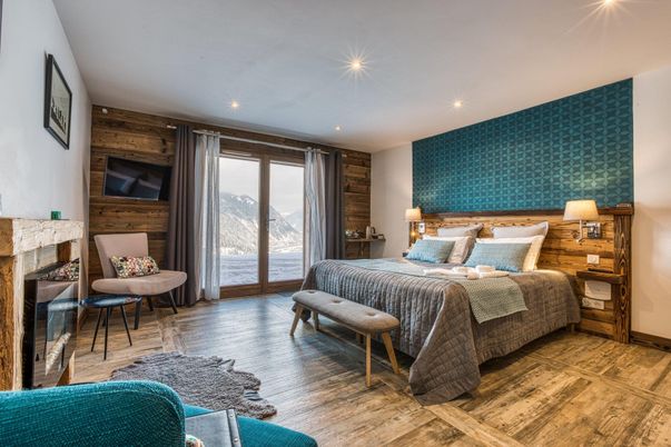 Bedroom, Fireplace, Interior, Recessed Lighting, Wood Texture Flooring, Wooden Walls