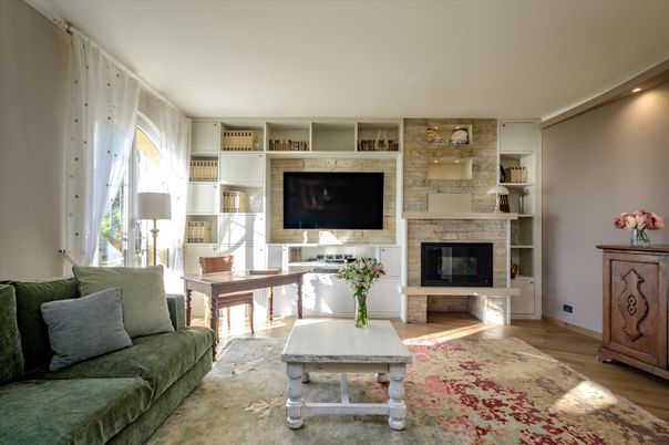 Fireplace, Interior, Living room, Recessed Lighting, Stone Walls, Wood Texture Flooring