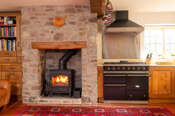 Fireplace, Interior, Kitchen, Stainless Steel Appliances, Stone Walls, Wood Texture Flooring