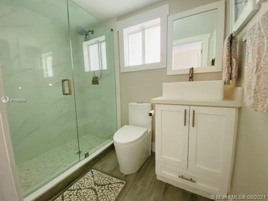 Bathroom, Glass Shower, Interior, Marble Walls, Wood Texture Flooring