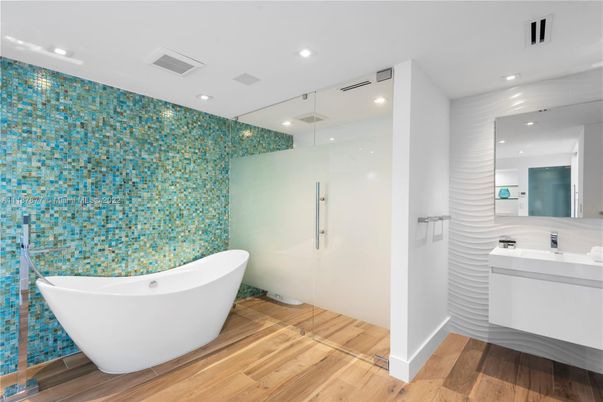 Bathroom, Free Standing Baths, Glass Shower, Interior, Recessed Lighting, Wood Texture Flooring