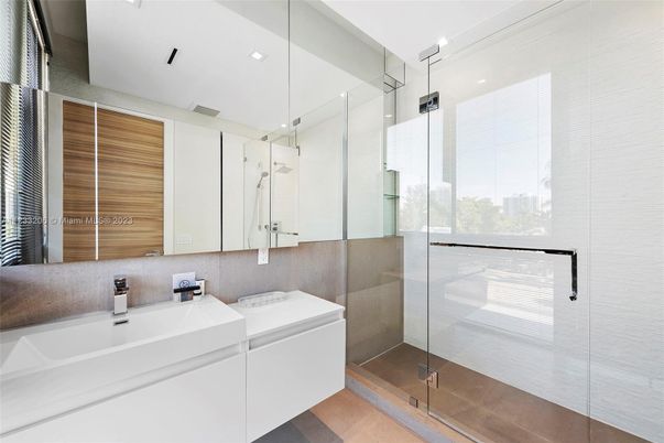 Bathroom, Glass Shower, Interior, Recessed Lighting, Washer, Wood Texture Flooring