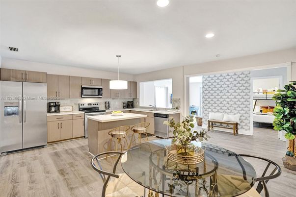 Dining room, Interior, Kitchen, Pendant Lights, Recessed Lighting, Stainless Steel Appliances, Wood Texture Flooring